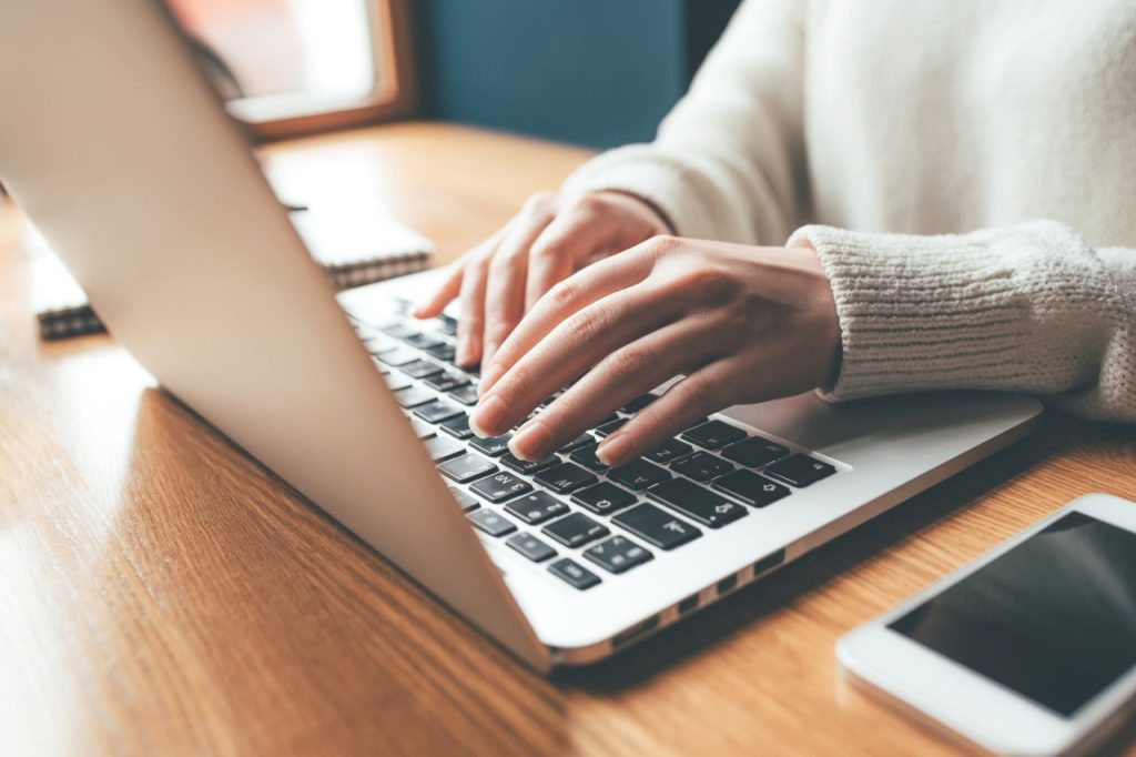 Logging in Woman logging in to website